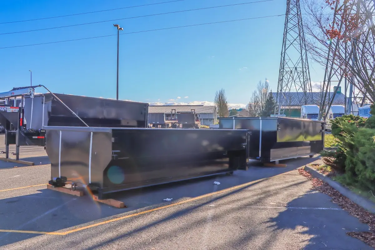 Roll-off dumpster ready for waste disposal at job site for Concrete Dumpster Rental in Wright